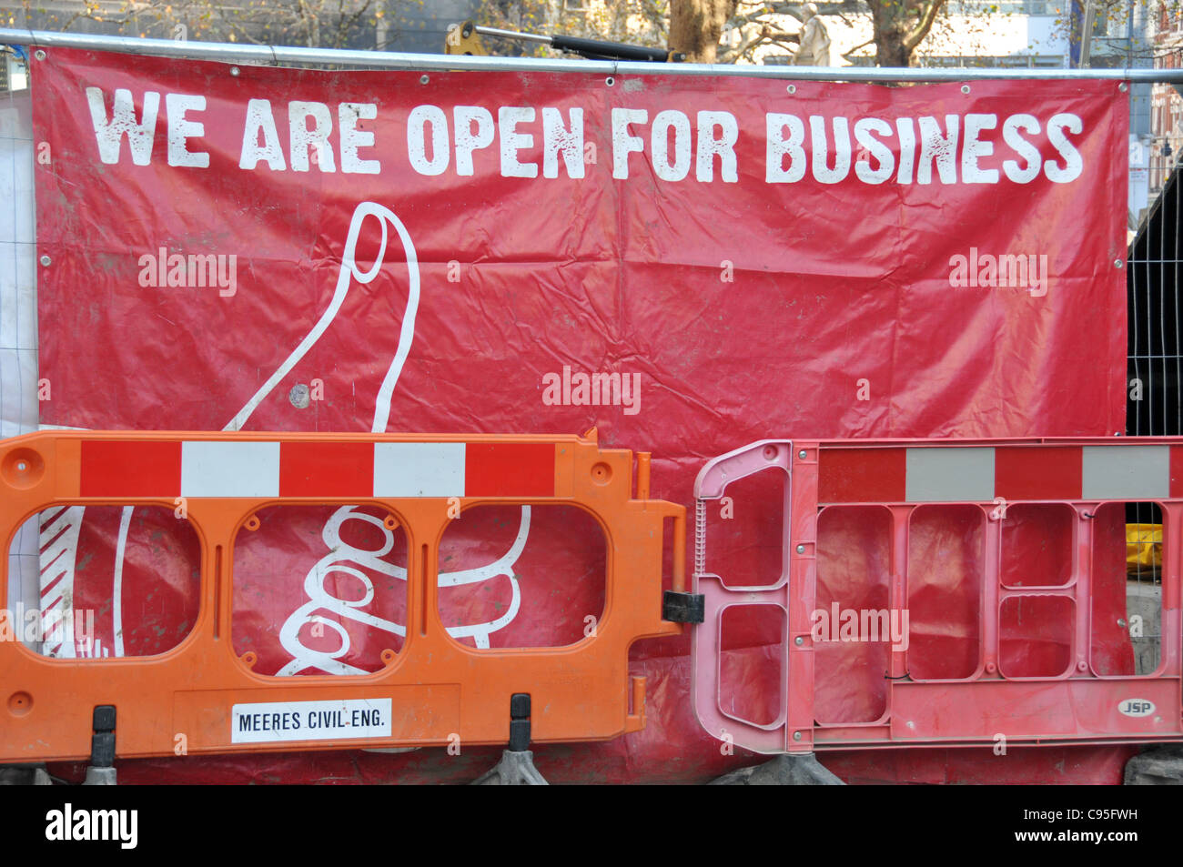 We are open for business ironic sign thumbs up optimistic recession Stock Photo
