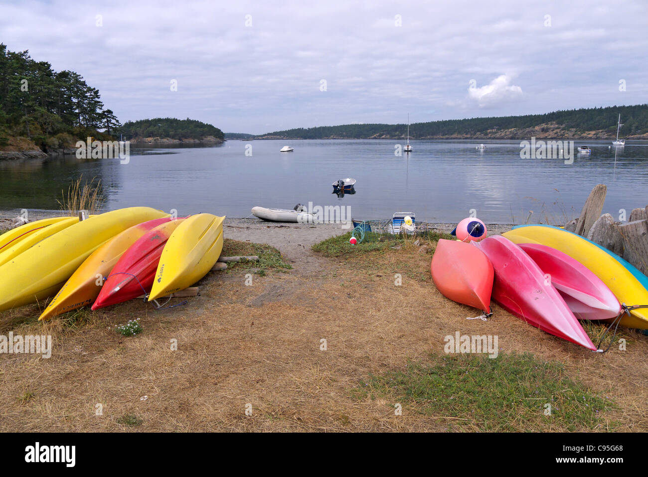Kayaks on shore of MacKaye Harbor Lopez Island WA USA Stock Photo Alamy