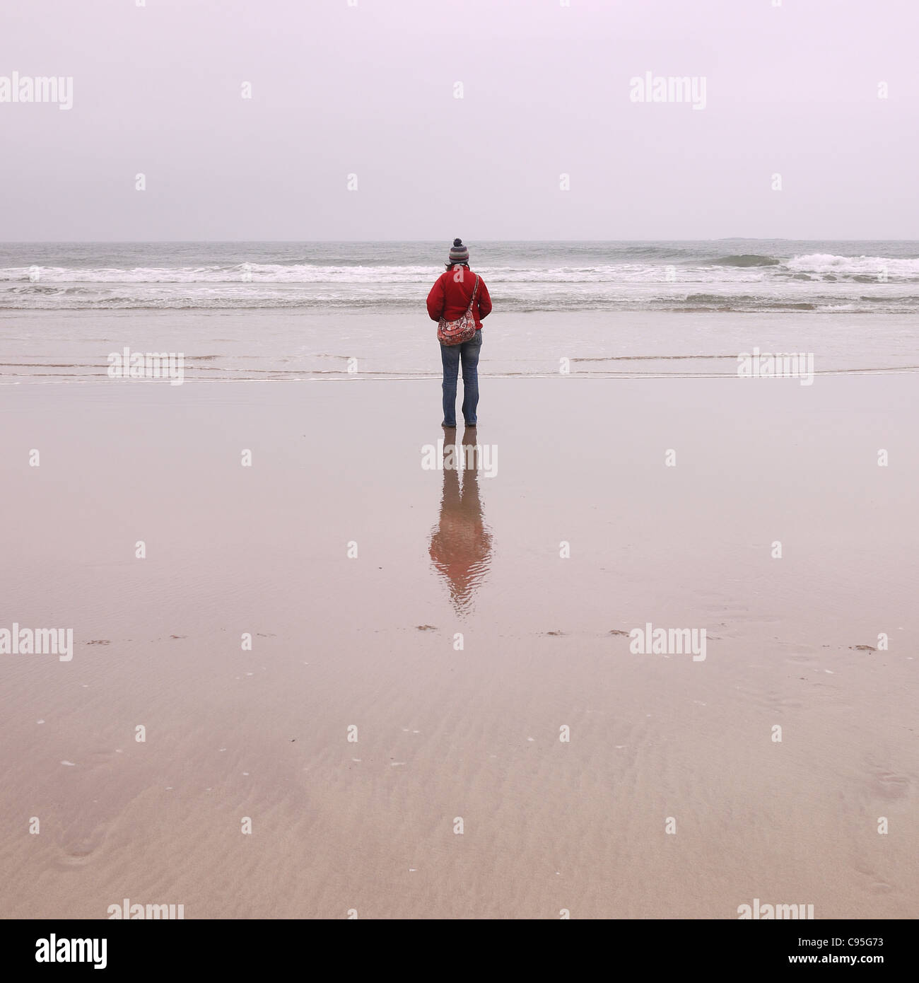 Figure reflecting on the beach. Embleton Bay, Northumberland Stock ...