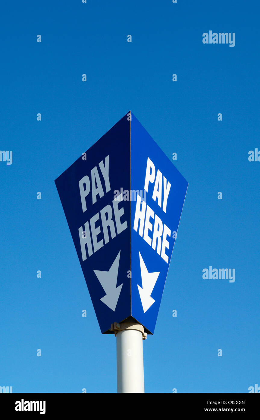 A pay here sign in a car park in England. Stock Photo
