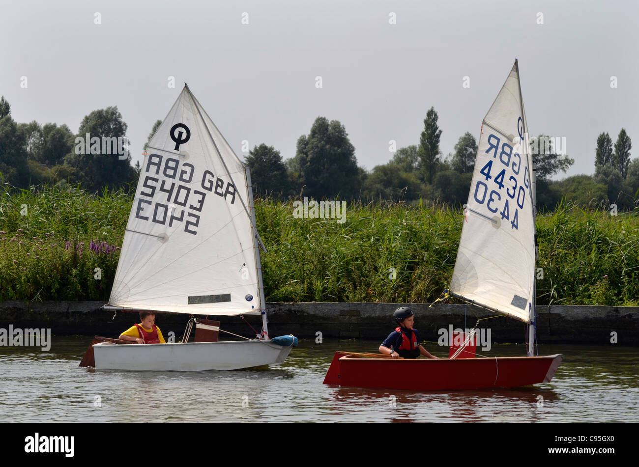 children sailing optimist dinghies Stock Photo