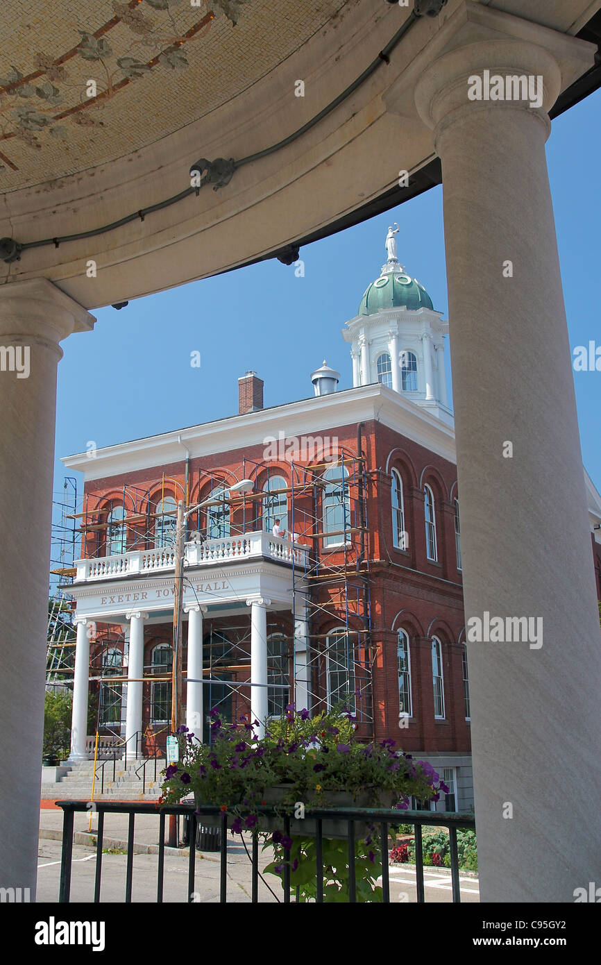 Exeter, New Hampshire's Town Hall, framed between columns of the