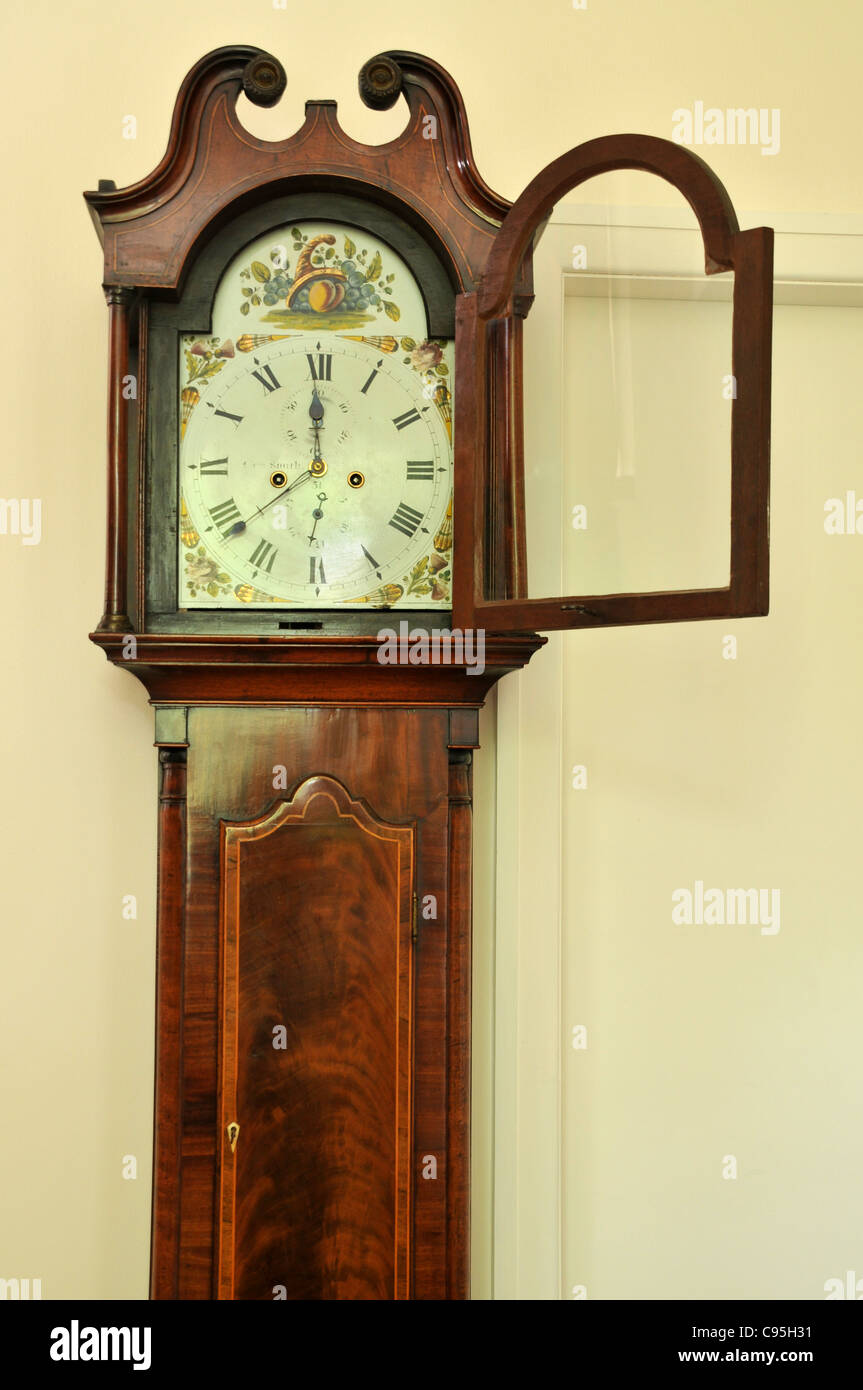 Three-quarter view of a grandfather clock with the glass door to it's face  open Stock Photo - Alamy