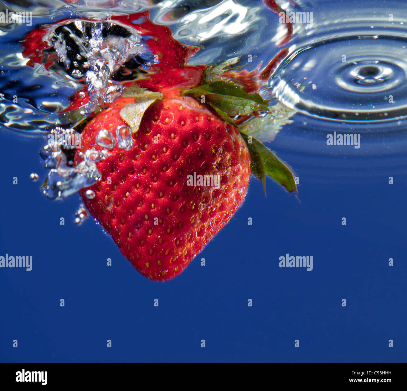 Strawberry splashing in water hi-res stock photography and images - Alamy