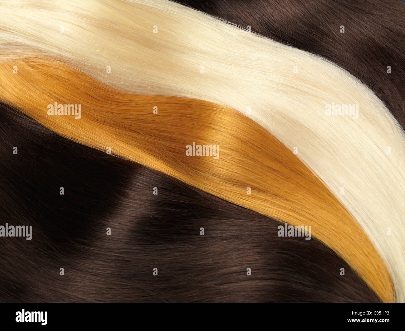 Natural human hair extensions of different colors Stock Photo