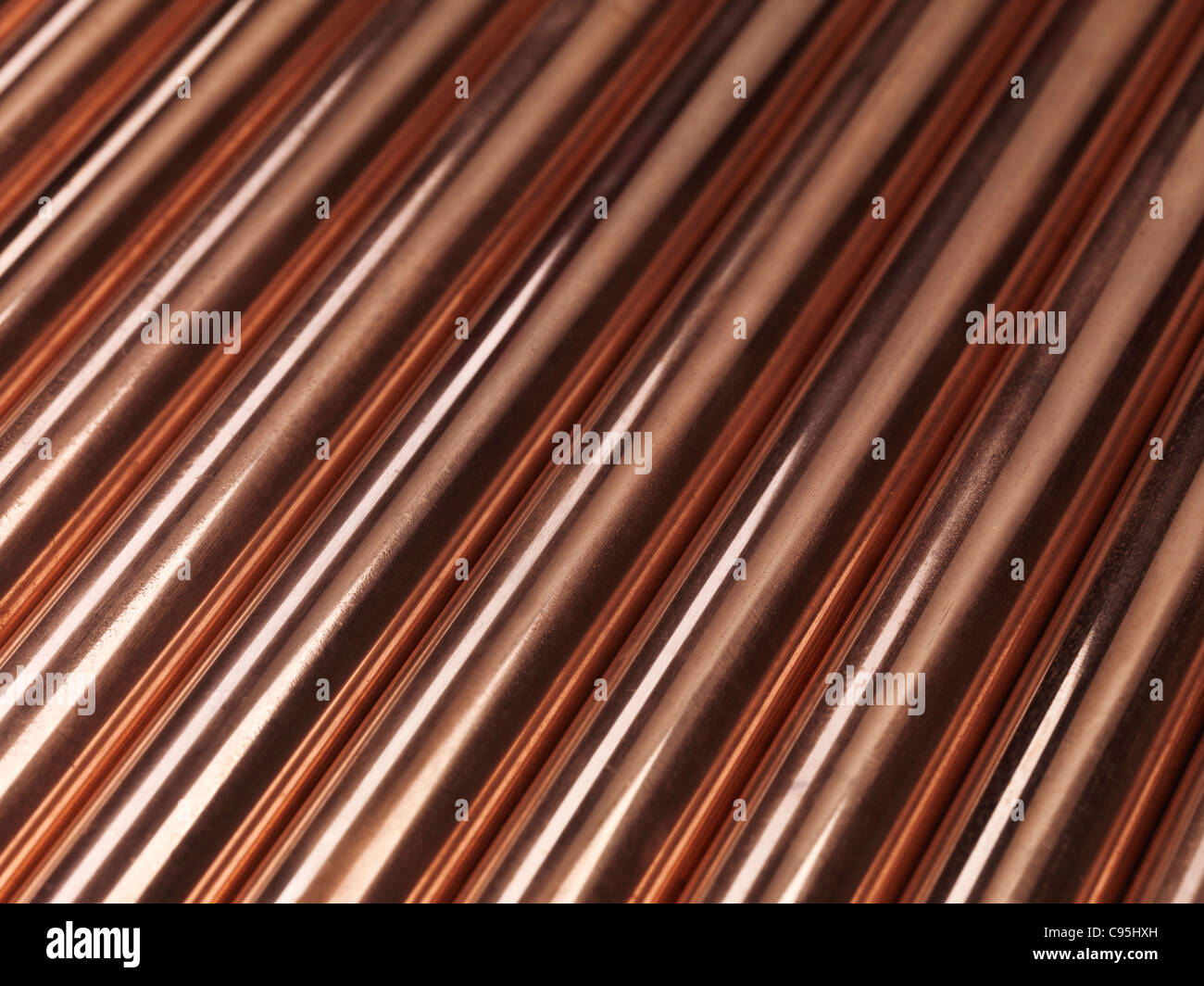 Shiny plumbing copper tubes abstract artistic background Stock Photo