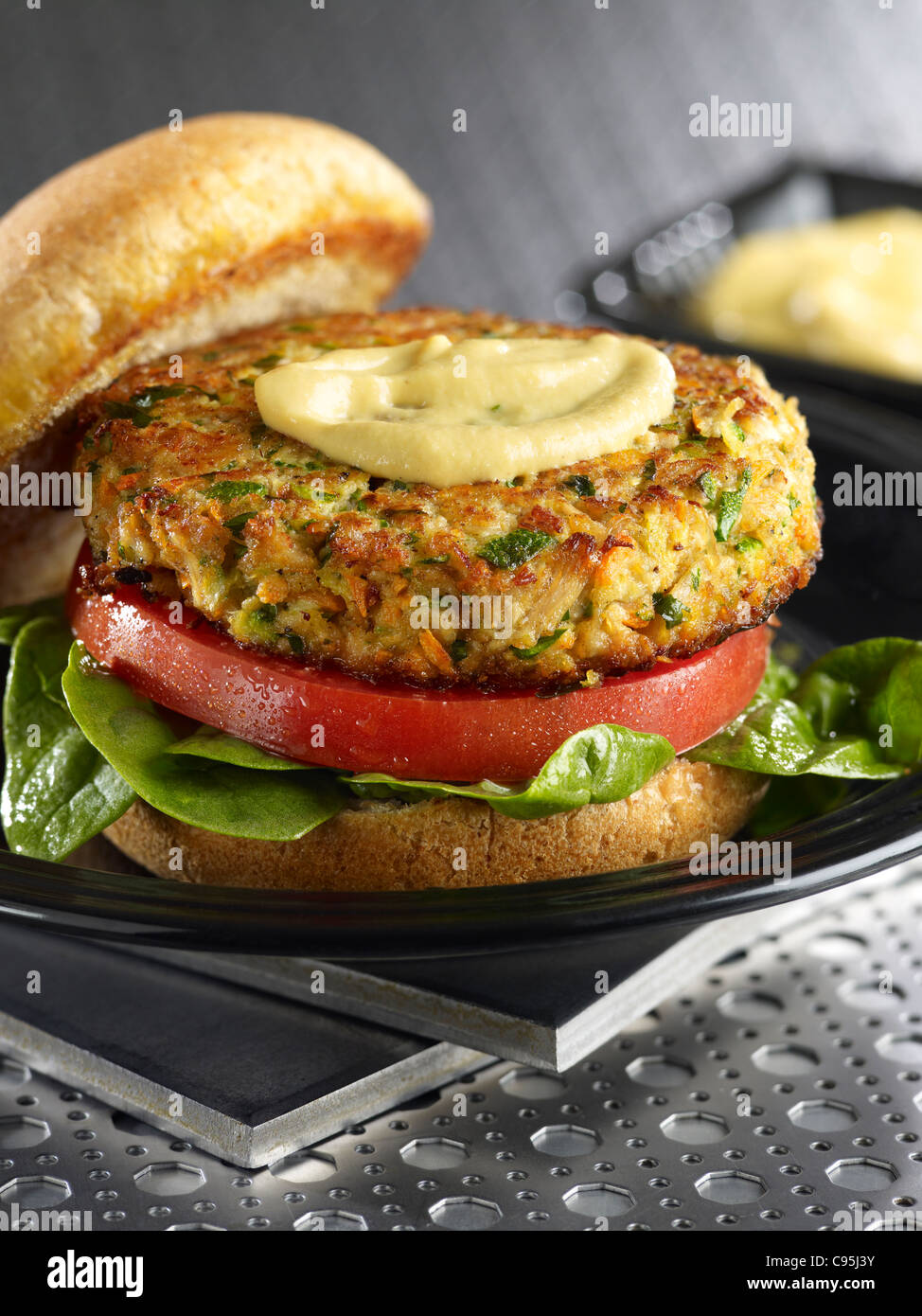 Chicken garden hamburger with spinach, lettuce and mustard Stock Photo