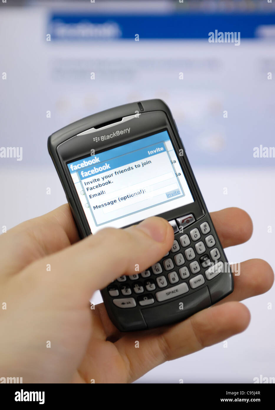 Facebook invitation screen on a display of Blackberry smartphone Stock Photo