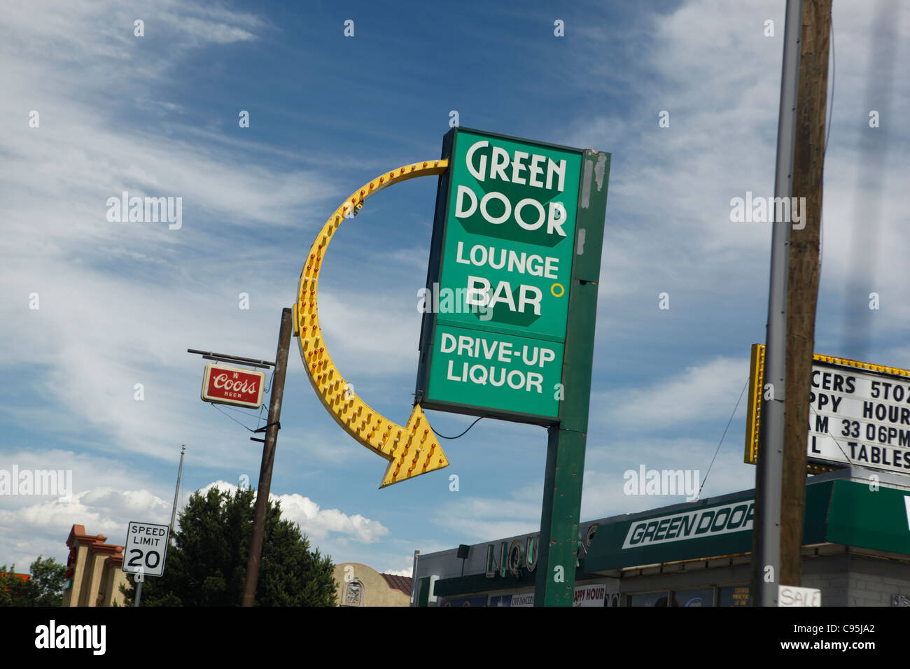 Green Door Lounge Bar Cheyenne Wyoming Summer Blue Sky Sign Stock