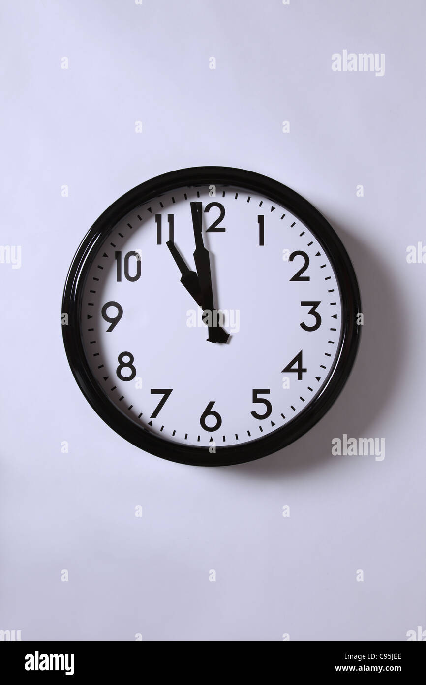 A clock at just before 11. Stock Photo