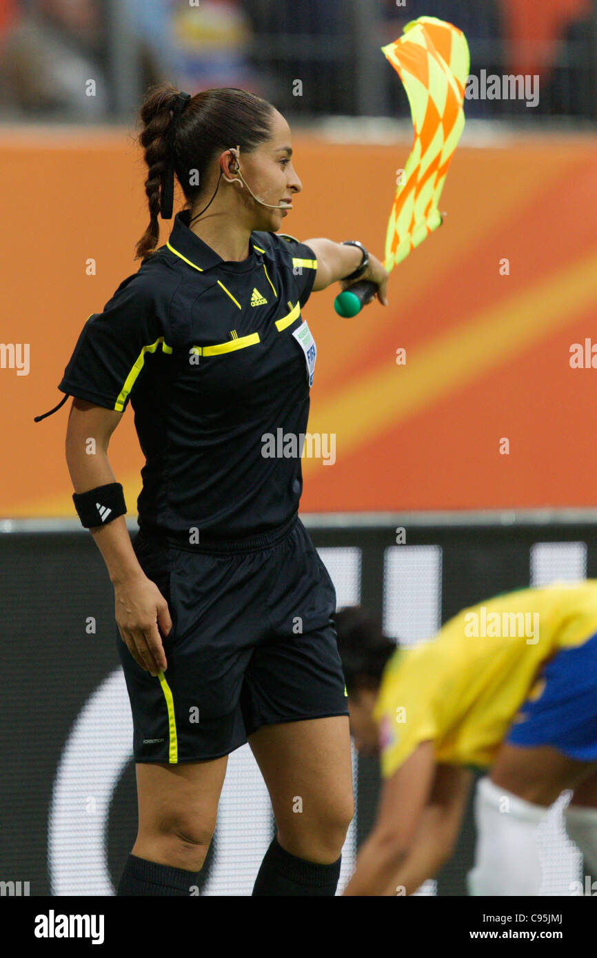 Assistant referee Veronica Perez waves her flag during a 2011 FIFA