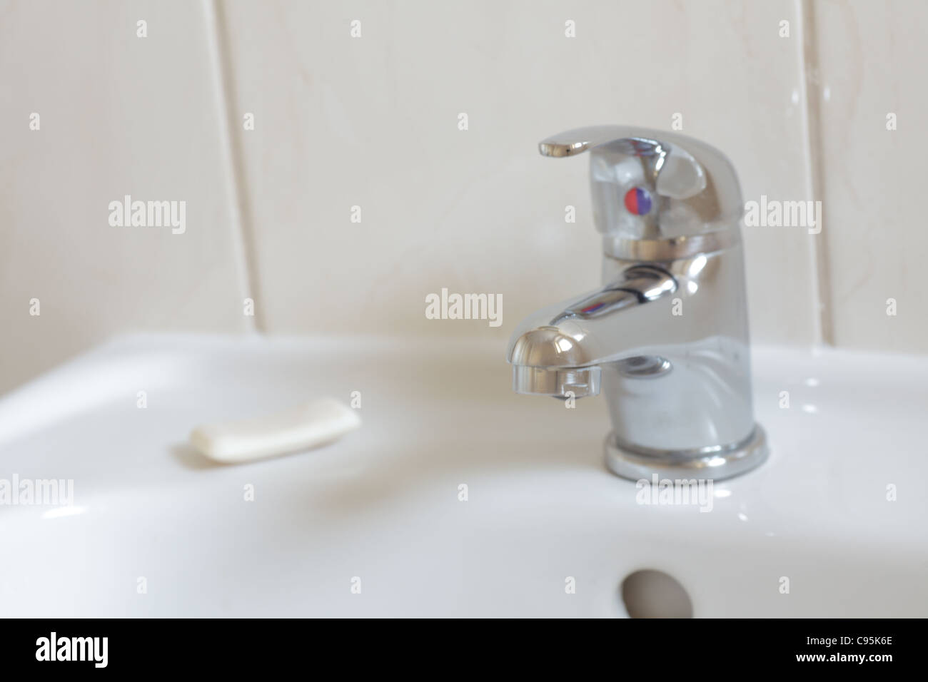 Bathroom interior with white sink and faucet - mixer tap Stock Photo - Alamy