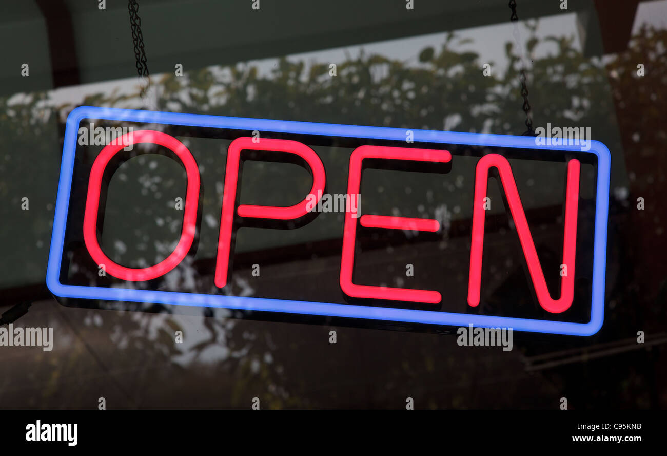A neon store "open" sign hangs in an Austin, Texas storefront Stock ...