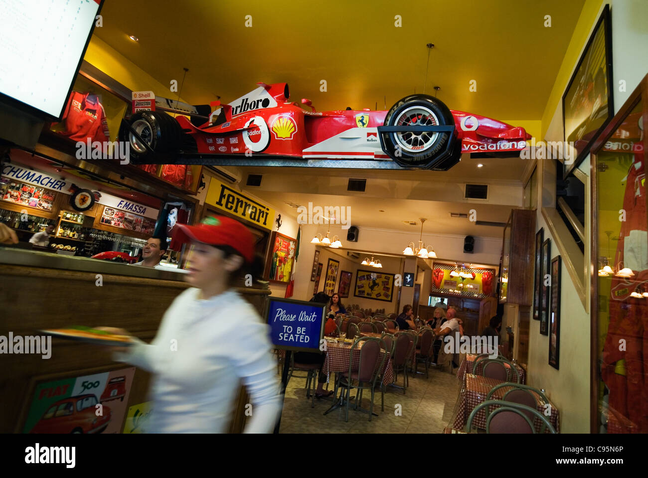 Ferrari memorabillia decorates an Italian restaurant on Melbourne's famed Lygon Steet in Carlton. Melbourne, Victoria, Australia Stock Photo