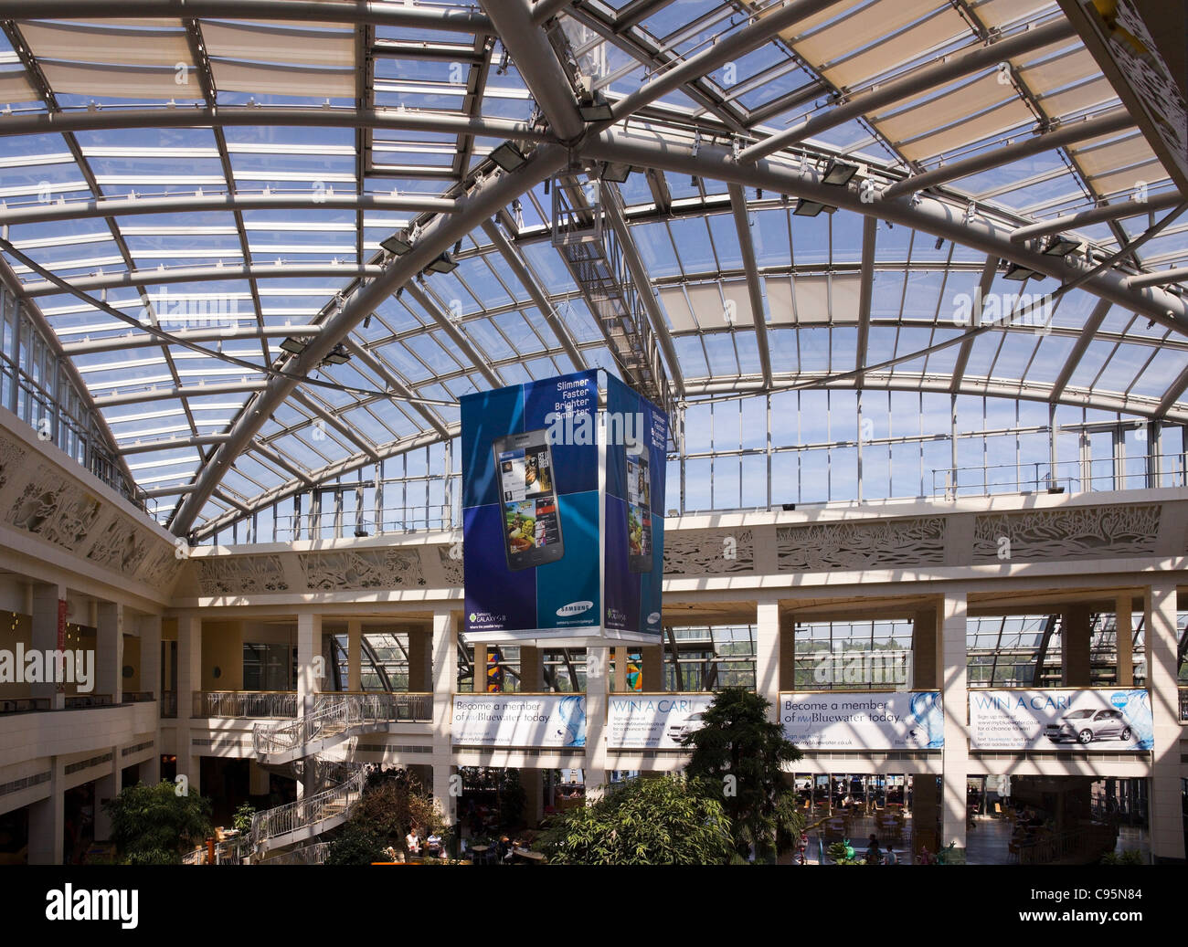Massive steel and glass roof atrium above Wintergarden food court at Bluewater shopping centre, Greenhithe, Kent, UK Stock Photo