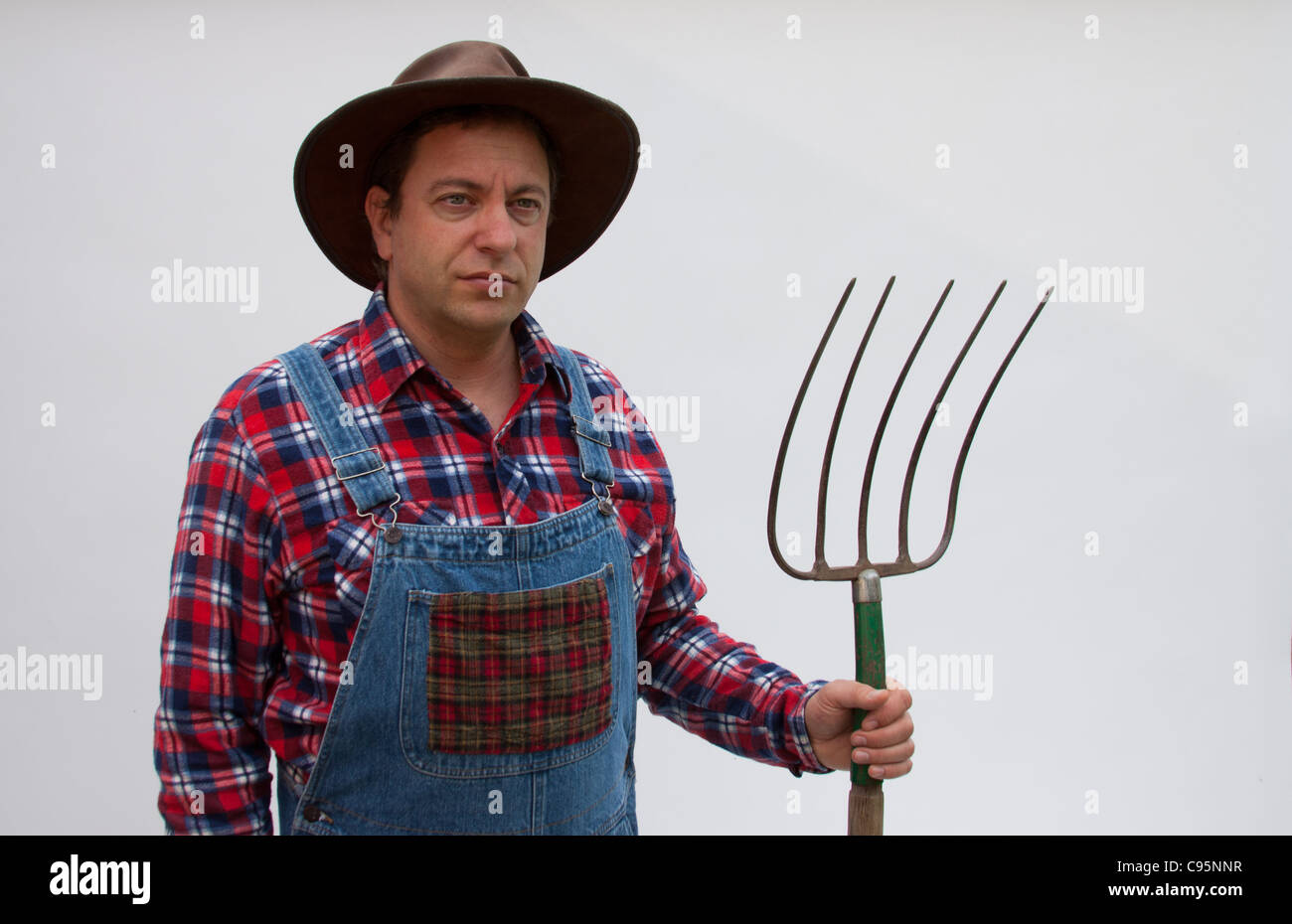 Farmer with pitchfork Stock Photo Alamy