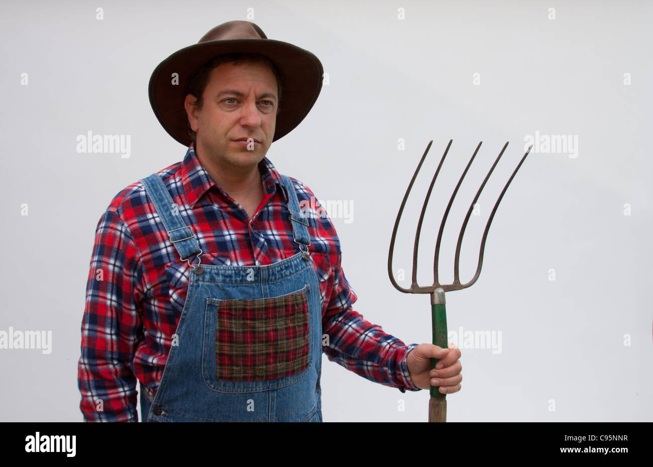 Farmer with pitchfork. Stock Photo