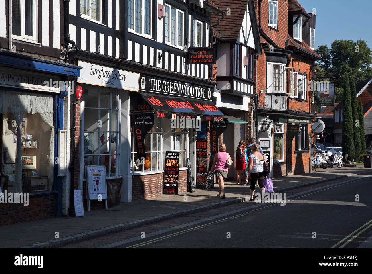 The busy High Street of Lyndhurst, the village is known as the Capital of the New Forest Stock Photo