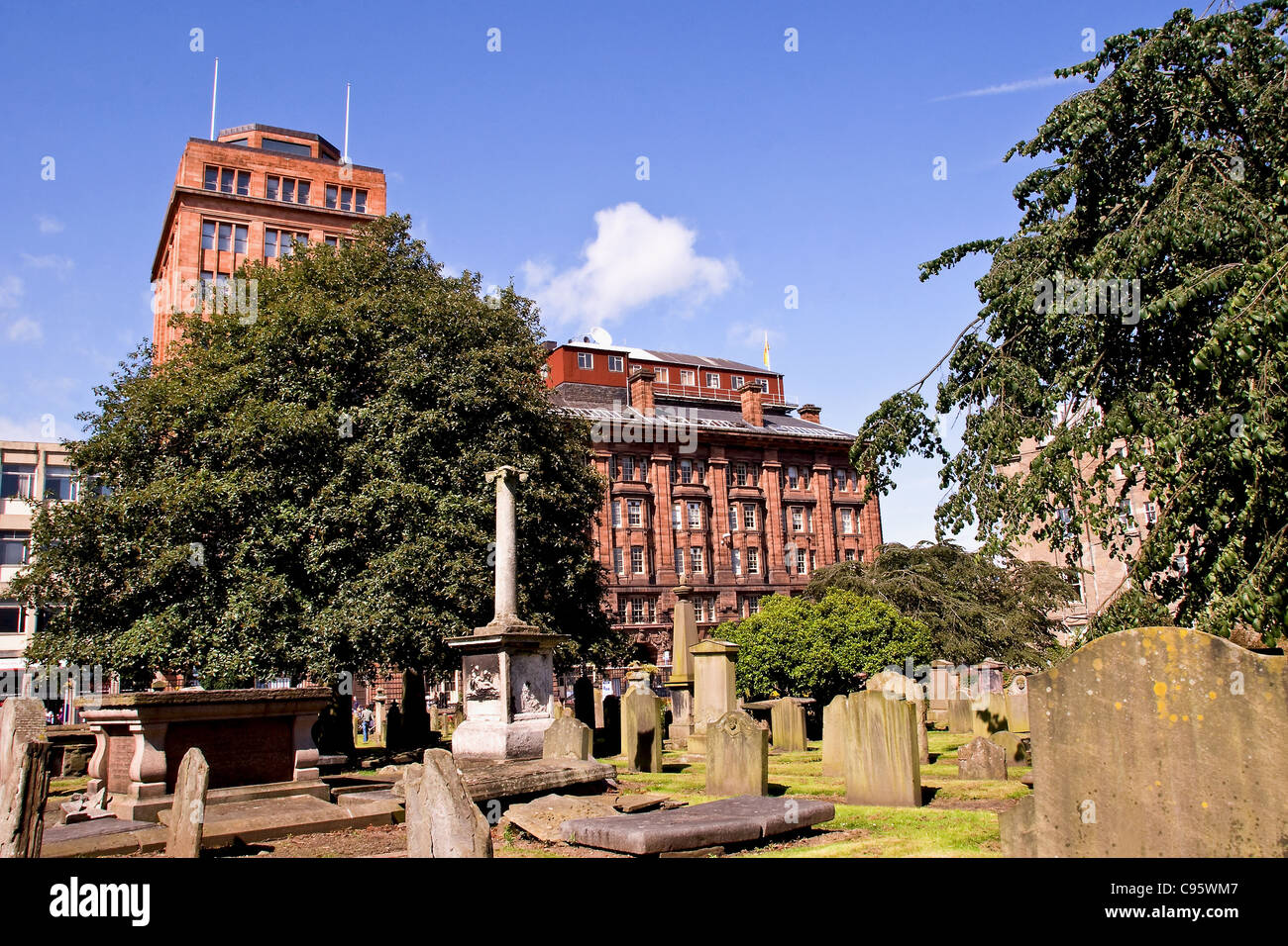 DC Thomson Editorial building and The Howff cemetery in central Dundee,UK Stock Photo