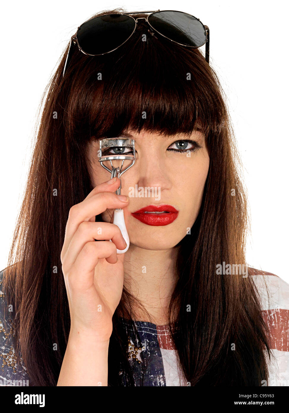 Young Woman Using Eyelash Curler. Model Released Stock Photo Alamy