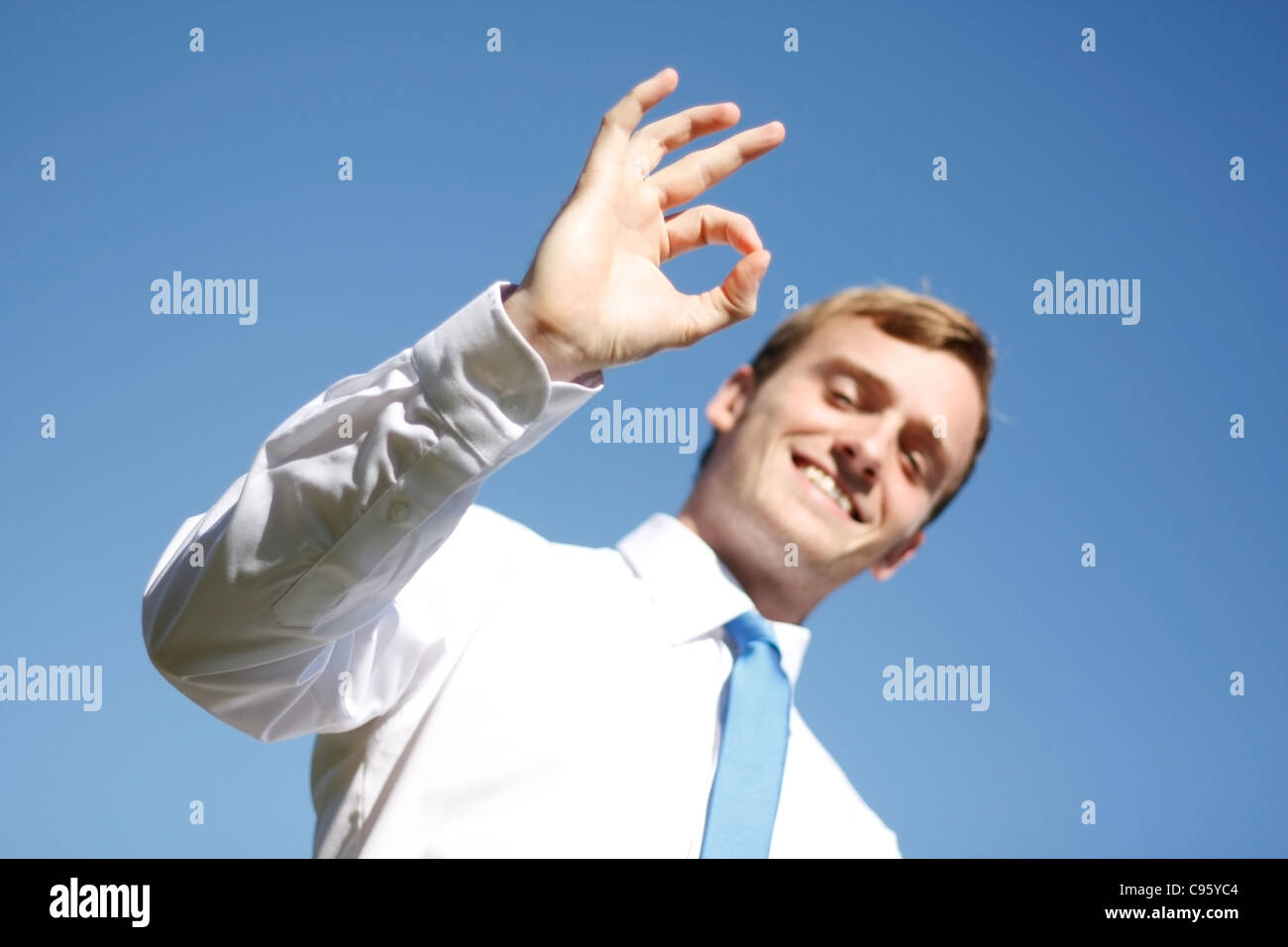 A business man displaying OK signs Stock Photo - Alamy