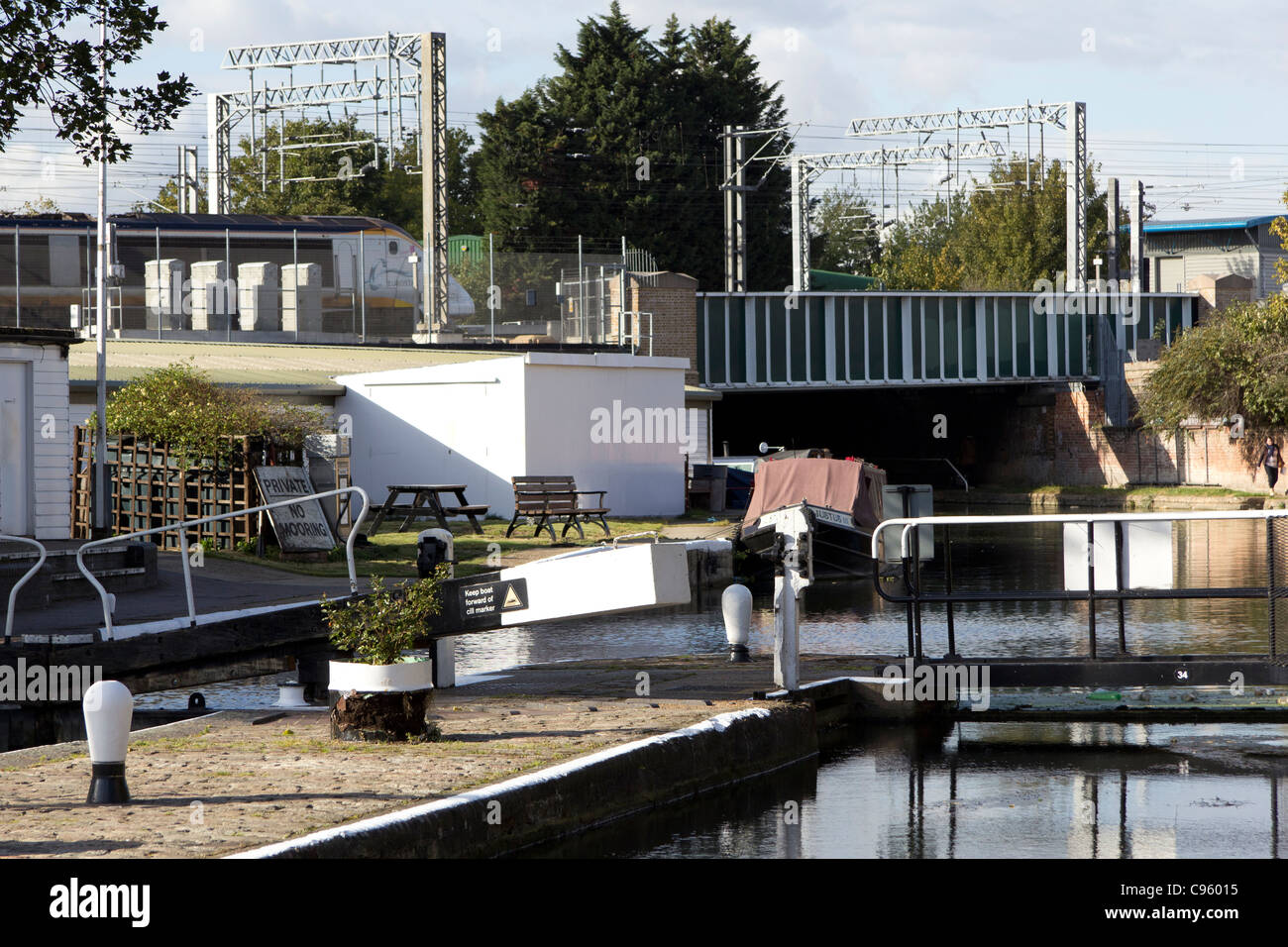 St Pancras lock on the Regents Canal, London with a Eurostar in the background on its way to Europe Stock Photo