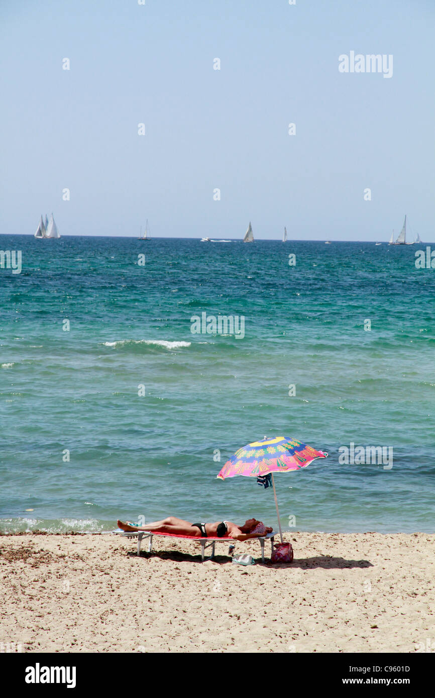 Woman sunbathing beach spain hires stock photography and images Alamy