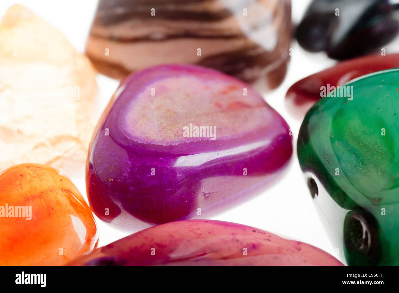 Assortment of semiprecious gemstones on white background Stock Photo