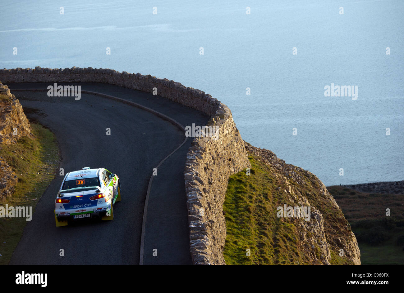 A rally car is seen during a stage of the Rally of Wales GBR November 2011 Stock Photo