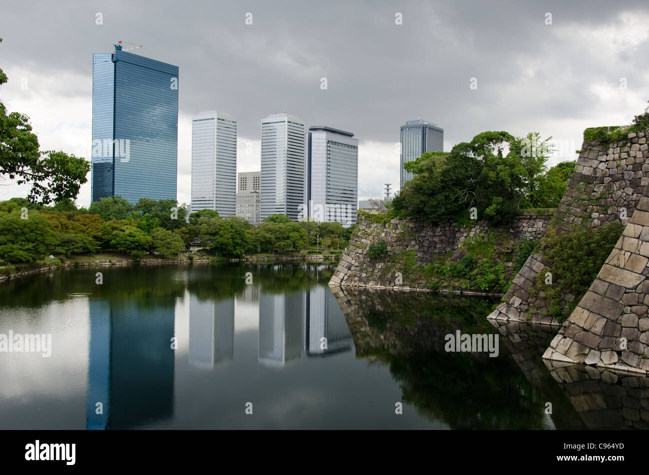 The Skyline of Osaka Business Park with the fortification walls of Osaka castle in the foreground Stock Photo