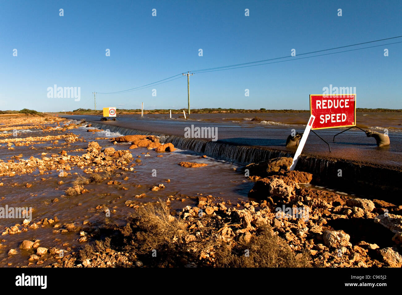 Road that has been washed away during a flood, Northwest Australia Stock Photo