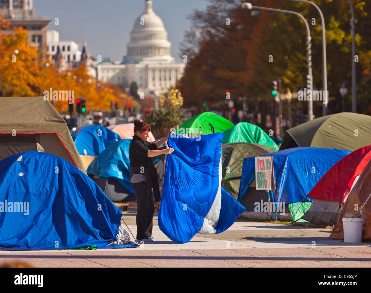 WASHINGTON, DC USA - Occupy Washington protest camp at Freedom Plaza and U.S. Capitol dome in distance. Stock Photo
