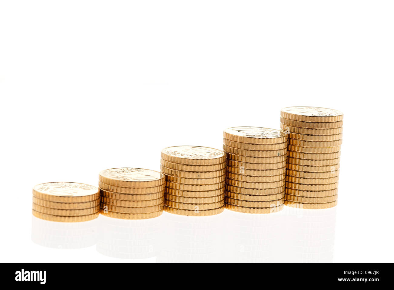 Some piles of euro coins on white background Stock Photo - Alamy