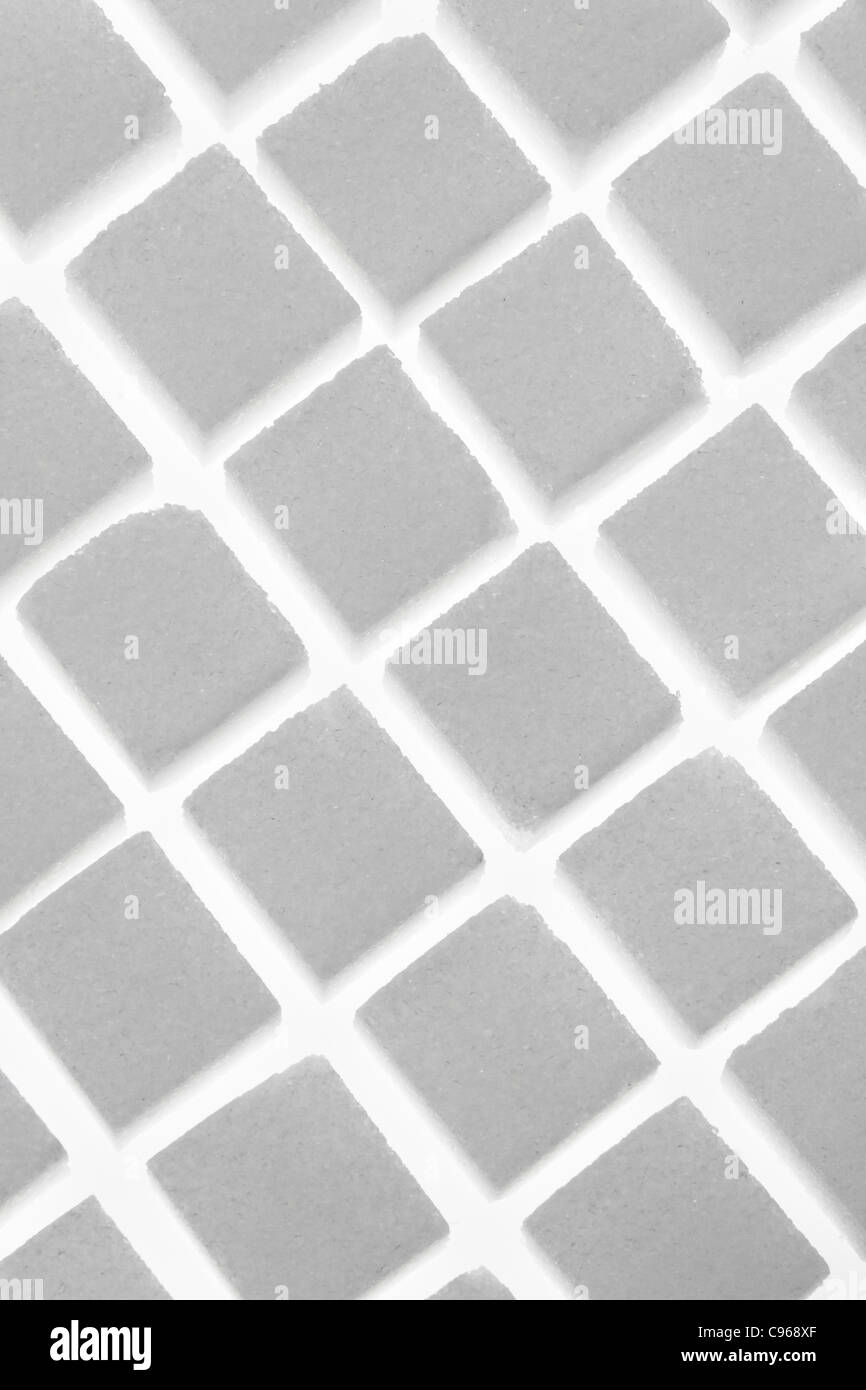 Many pieces of sugar to sweeten it isolated on a white background Stock Photo