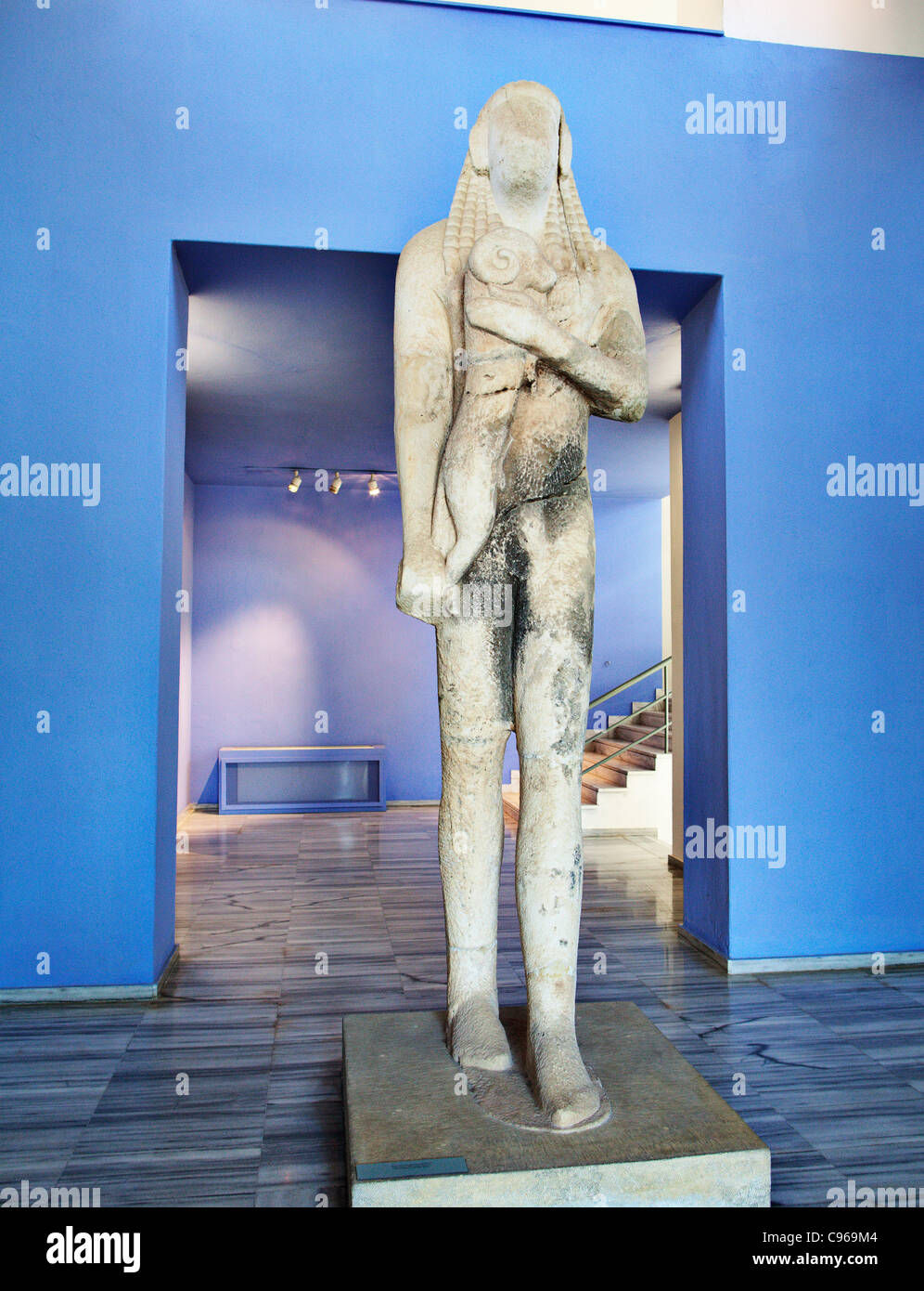 Kouros, a statue of a young man with a ram in archeological museum in Limenas, Thassos island, Greece. Stock Photo