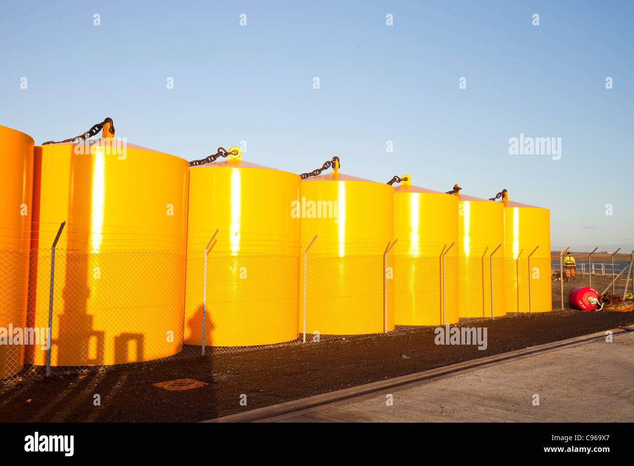 Floatation devices on lyness harbour, Hoy, Orkney Isles, Scotland, UK. Stock Photo