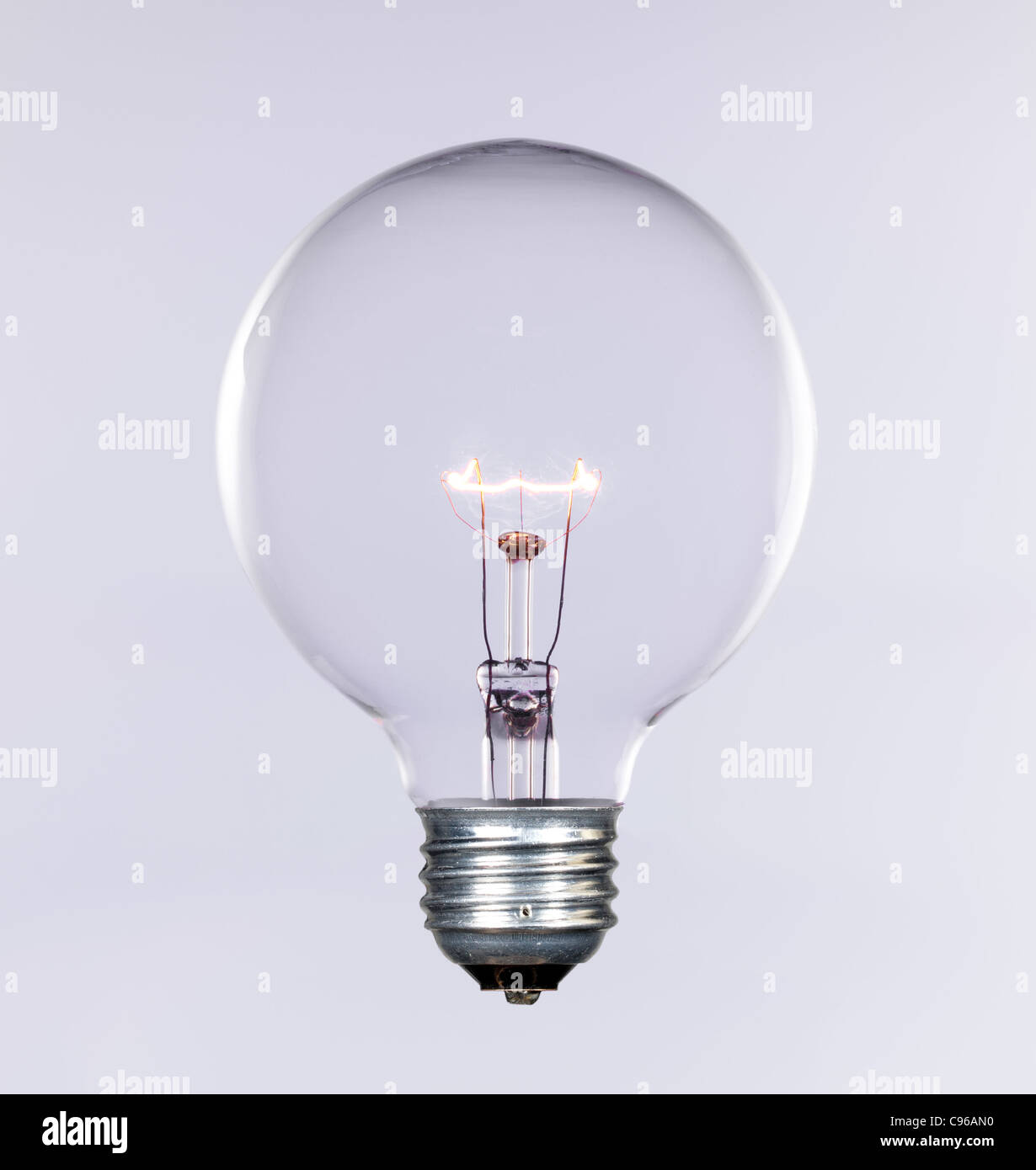 Glass incandescent tungsten filament light bulb due to be replaced due