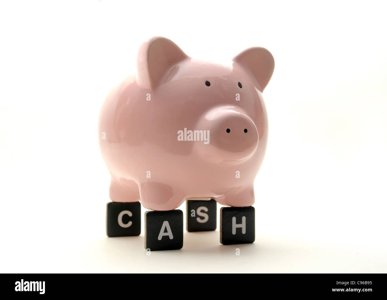 PIGGY BANK ON LETTERS SPELLING 'CASH' RE FINANCIAL CRISIS SAVINGS ECONOMY ECONOMIC DOWNTURN MONEY  BANKS CASH INCOME WAGES  UK Stock Photo