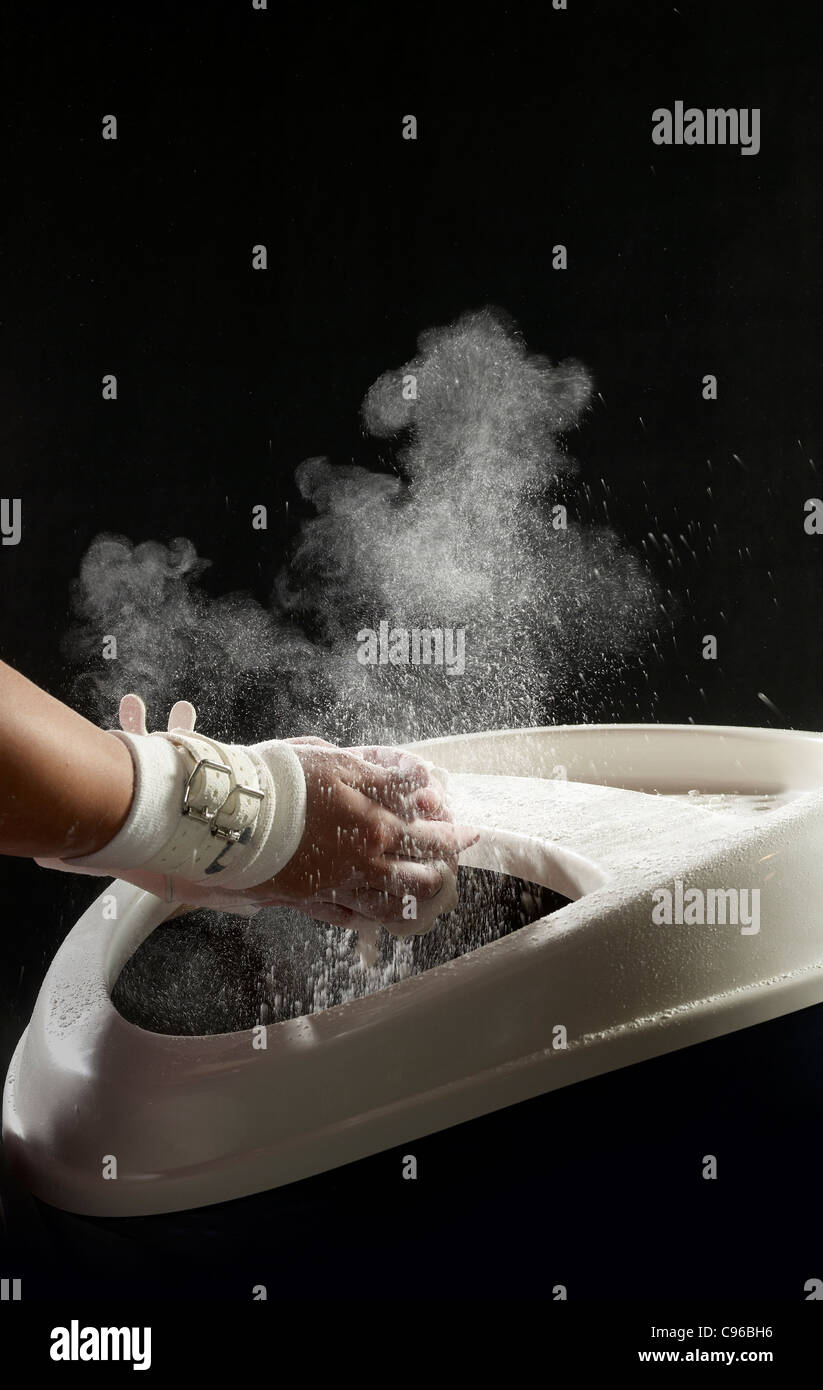 Gymnast Applying Chalk Powder To Her Hands Before Competing, USA Stock Photo