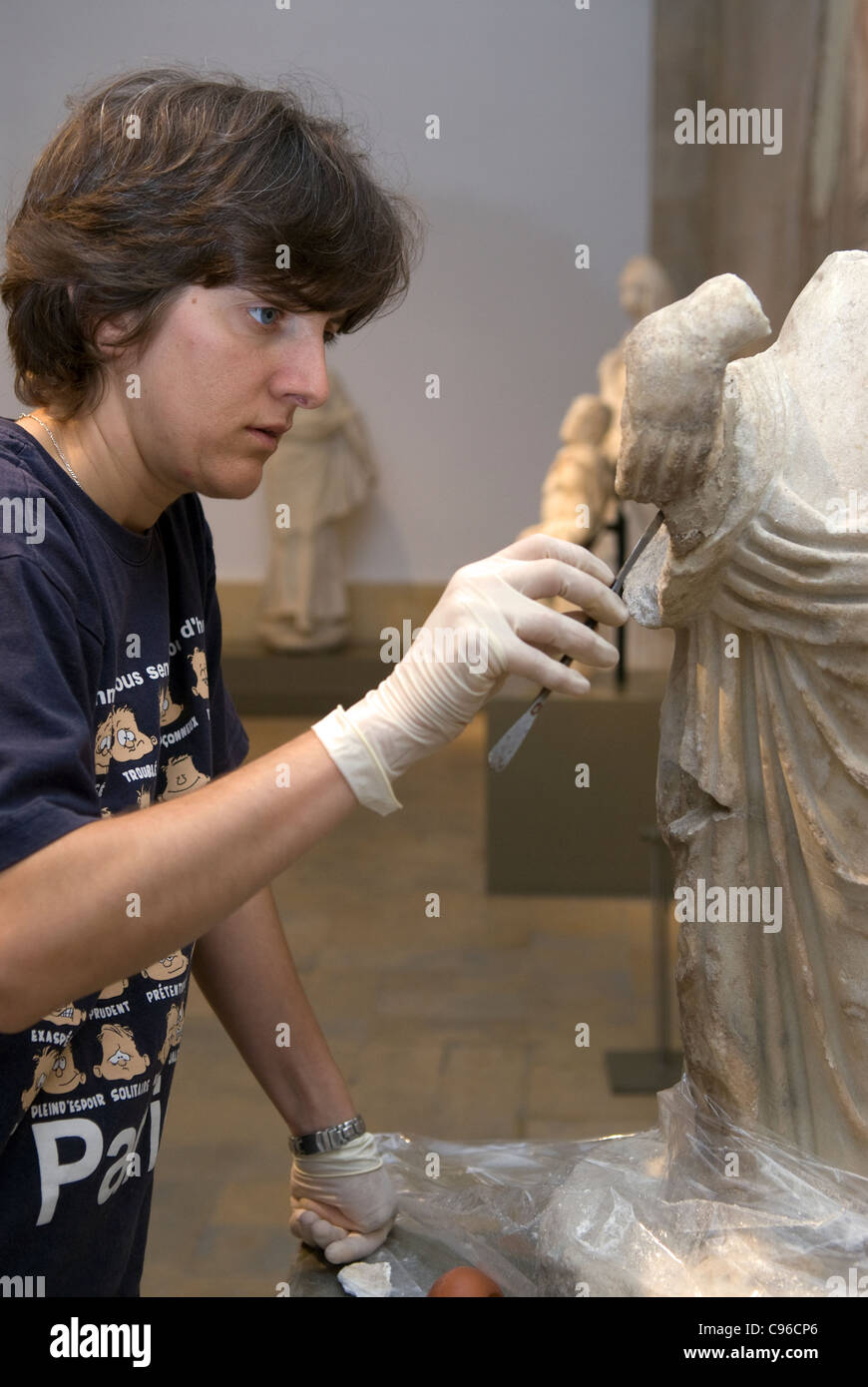 Archaeologist carrying out restoration work on an artifact at Beirut's National Museum, Badaro, Beirut, Lebanon. Stock Photo
