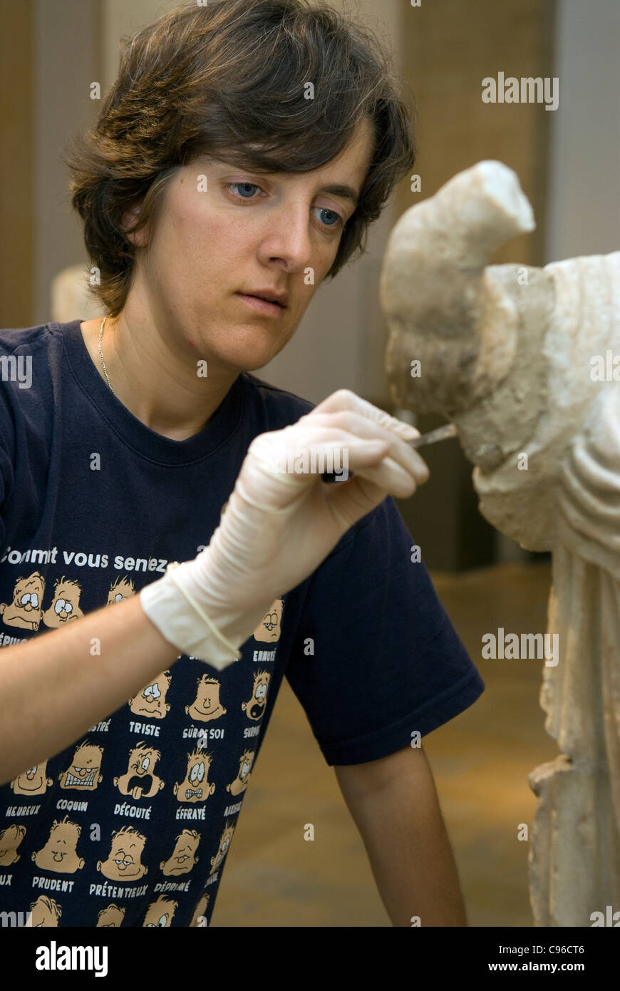 Archaeologist carrying out restoration work on an artefact at Beirut's National Museum, Beirut, Lebanon. Stock Photo