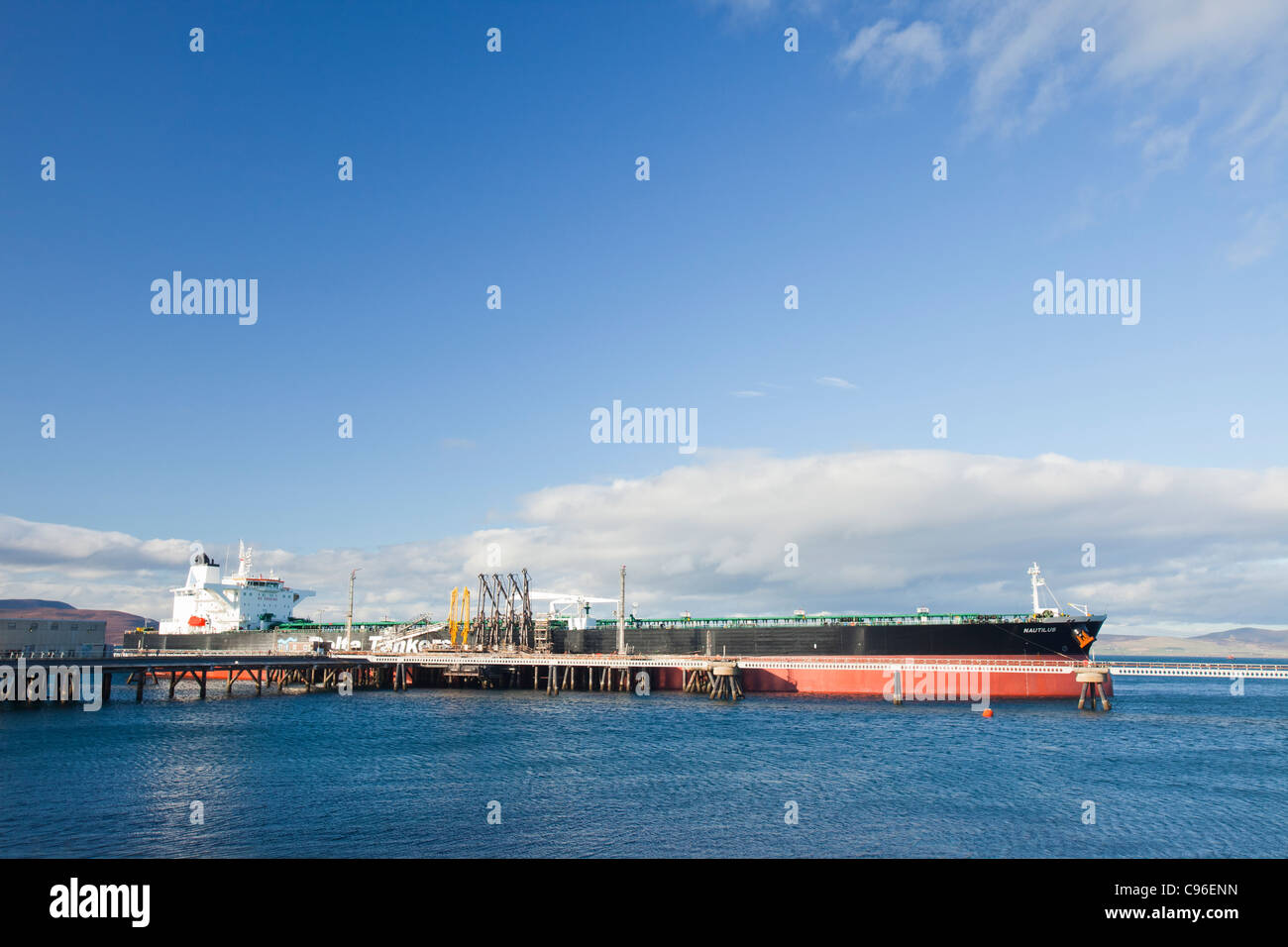 A Greek oil tanker docked at the Flotta oil terminal on the Island of Flotta in the Orkney's Scotland, UK. Stock Photo