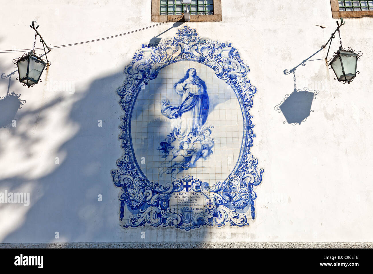 Typical portuguese blue tiles (azulejos) with an image of the Virgin Mary in the Santa Estefania in Guimarães Children's Home. Stock Photo
