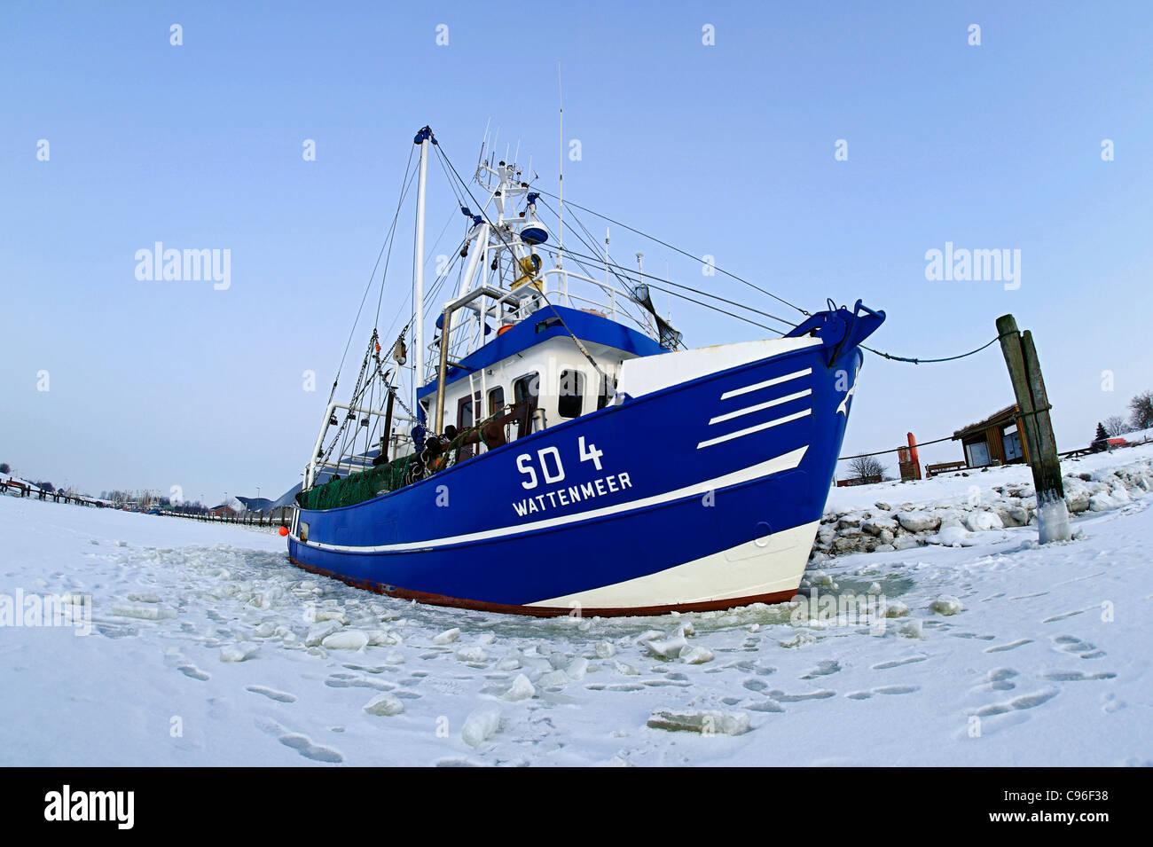 Frozen ship in the harbor, Friedrichskoog, Kreis Dithmarschen district, Schleswig-Holstein, Germany, Europe Stock Photo