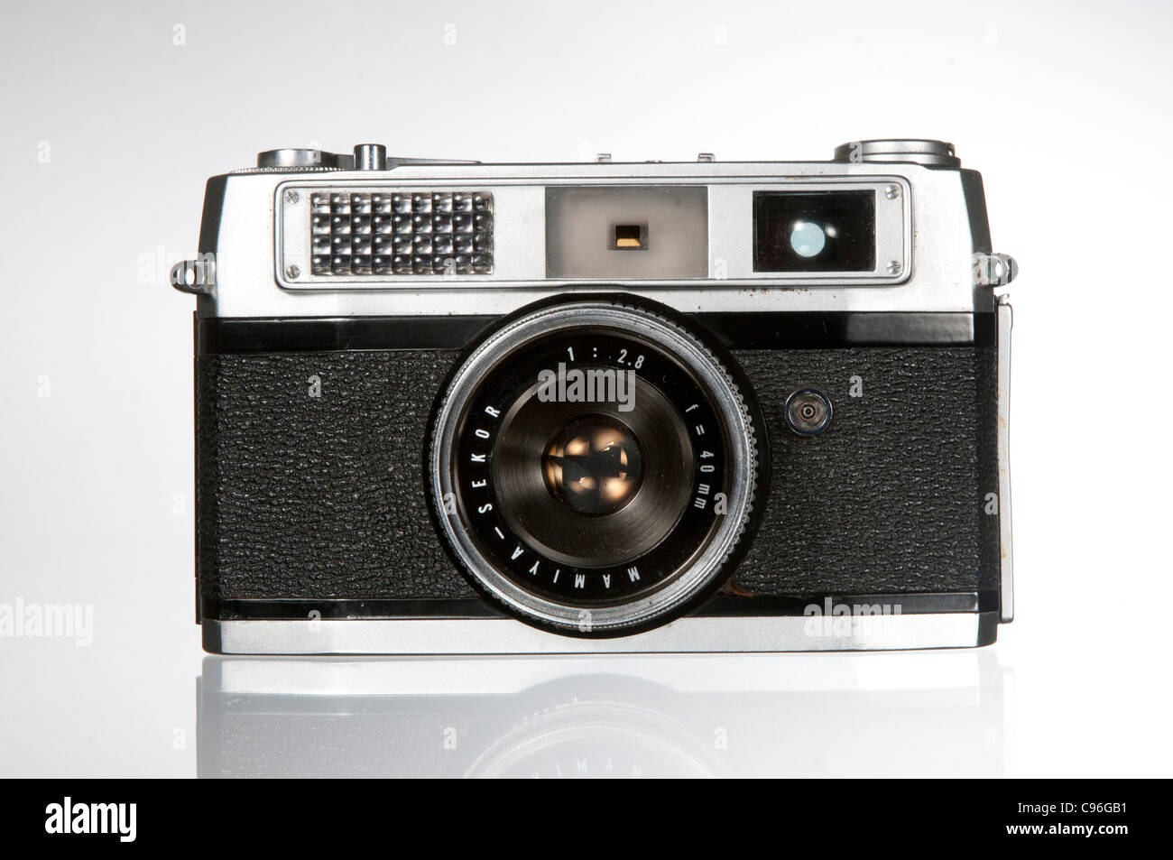 An old  mamiya 35mm snapshot camera photographed against a white background Stock Photo