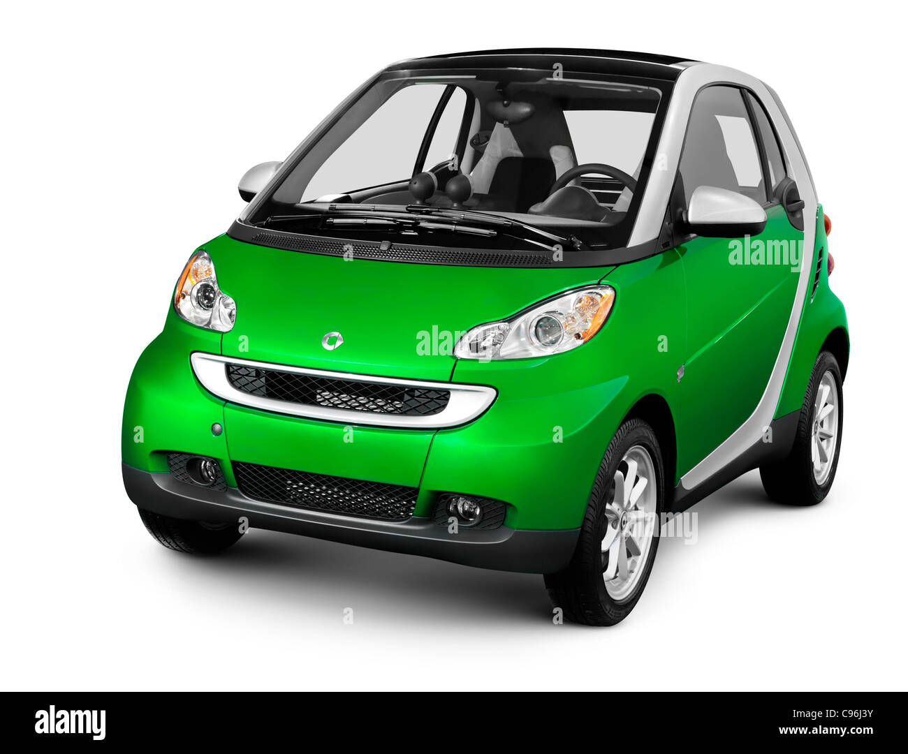 Green fuel efficient mini car Smart Fortwo. Isolated silhouette with a clipping path on white background. Stock Photo