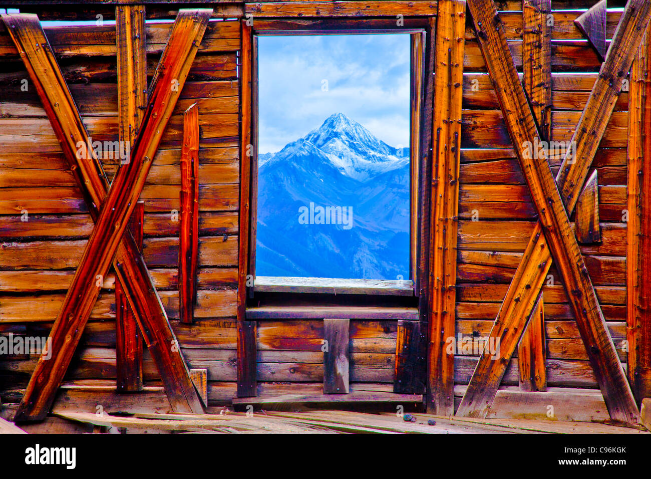 Wilson Peak seen through ghost town window, Alta Ghost Town, Colorado, Uncompahgre National Forest, San Juan Mountains Stock Photo