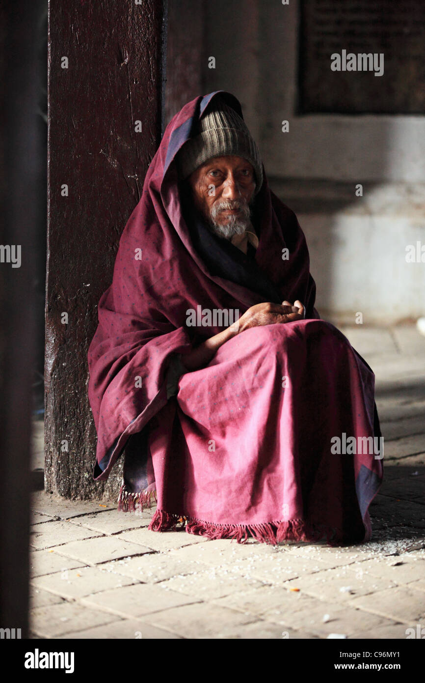 Poor old man sitting in hi-res stock photography and images - Alamy