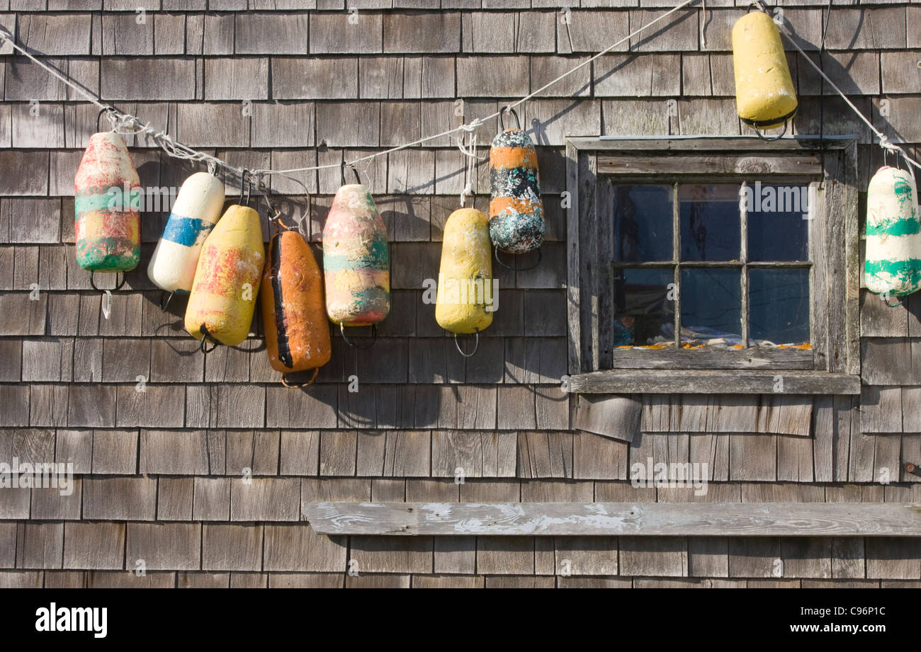 Old buoys on a exterior wall Stock Photo