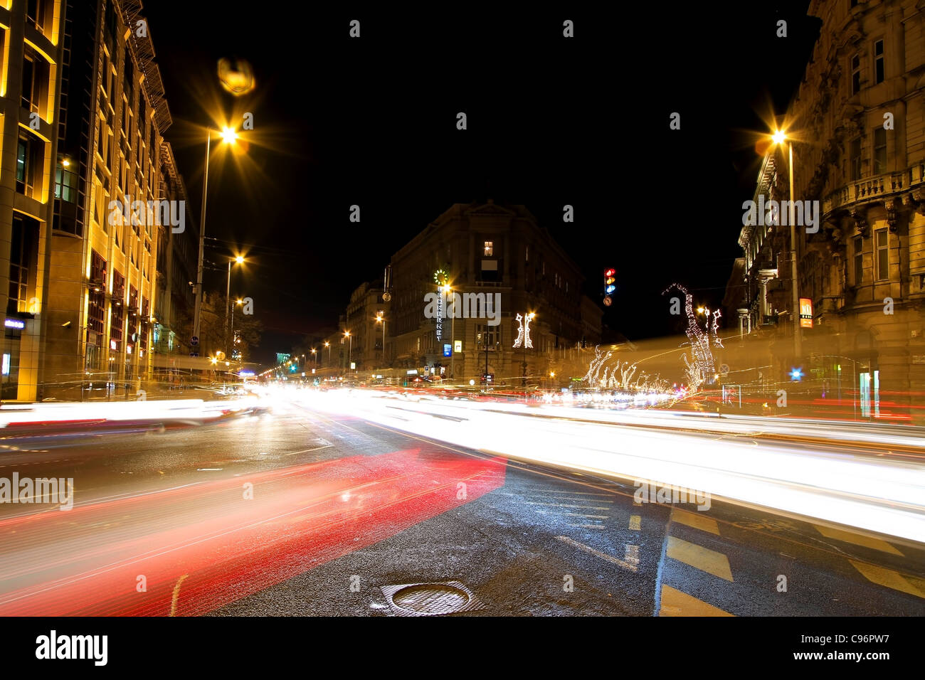 European crossroad at night with traffic lightstreaks Budapest - Hungary Stock Photo